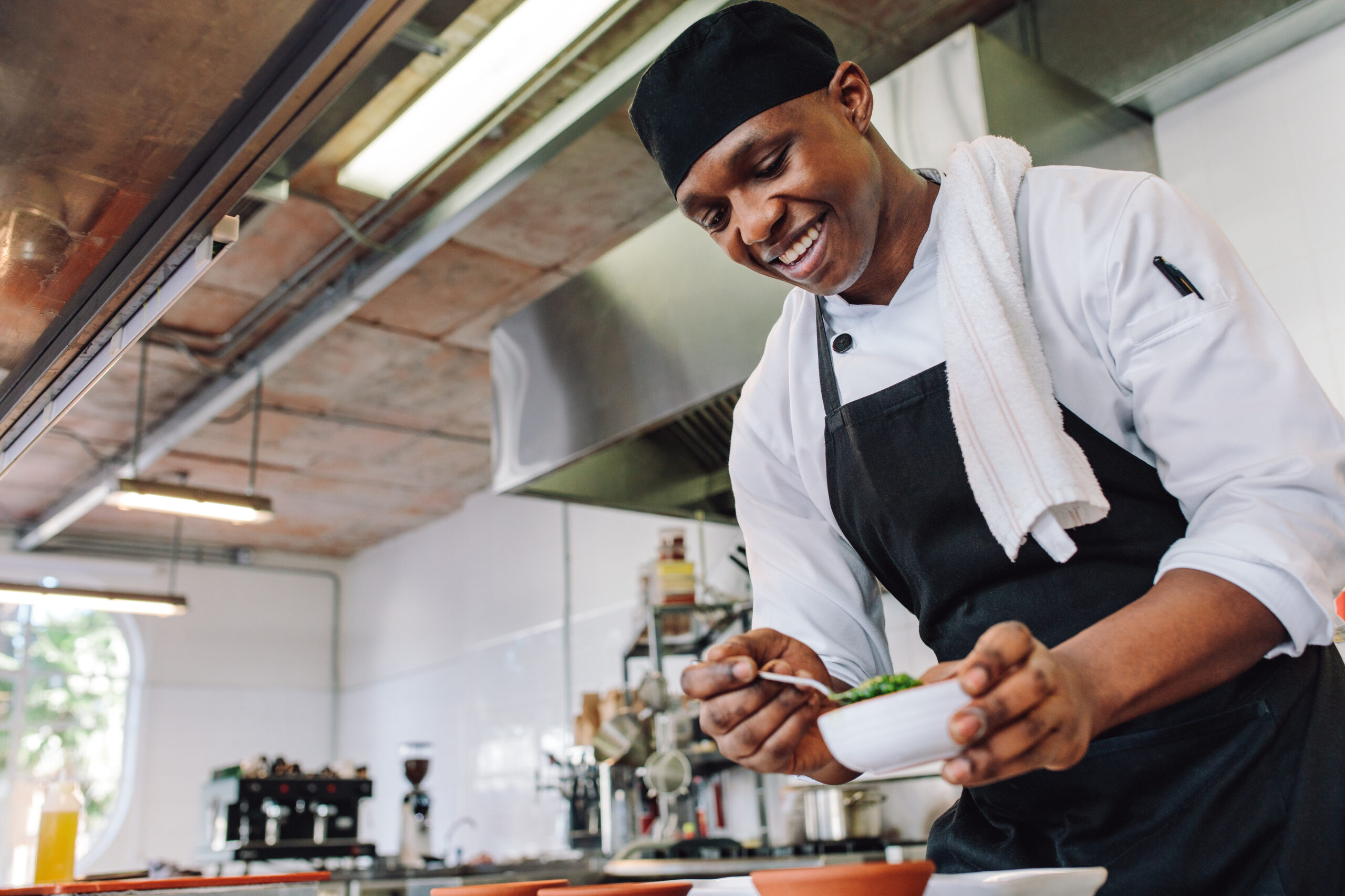 african american chef cooking in a kitchen