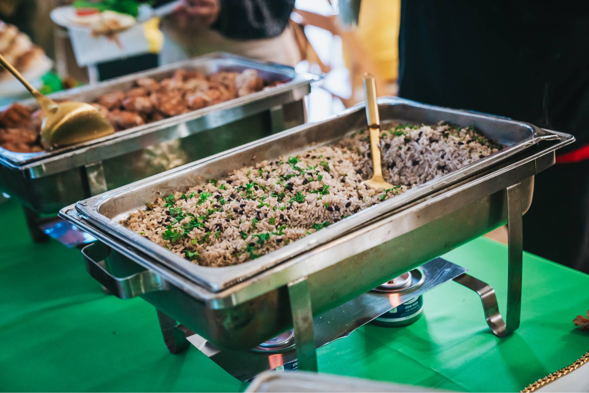 a tray of rice and beans at an equitable food oriented development event on a farm